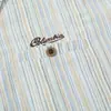 Camisa masculina de manga longa com listras verticais estilo retrô americano, corte solto, adequada para primavera e outono, estilo de rua, casual e versátil, com colarinho de lapela