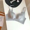 Productos originales genuinos Ropa interior de algodón de leche japonés para mujer Sujetador inalámbrico push up para realce de busto ajustable para exportación de comercio exterior