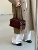 Bolso de mano de gamuza retro simple coreano para mujer Otoño/Invierno 2026 Nuevo para el trabajo Gran capacidad Hombro único Bolso de axila