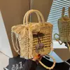 Bolso tejido hueco nuevo del fabricante 2026 nueva versión coreana de moda bolso de hombro cruzado de moda cereza bolso de mano versátil