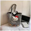 Nova bolsa de ombro fofa para meninas Hello Kitty bolsa de trabalho versátil desenho animado grande capacidade listrada bolsa de reforço transfronteiriça
