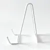 Soporte de plato de hierro blanco en forma de N, estante decorativo para platos, soporte para pasteles de té Pu'er, marco de fotos de hierro, estante de hierro