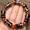 Venta al por mayor de fábrica Pulsera con patrón de respaldo de ágata amarilla de diente de Xizang, pulsera de cuenta de bambú de ágata verde, alta en aceite, de tres ojos, de nueve ojos