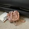 Nuevo bolso cubo retro de nicho 2026 para mujer, bolso tote versátil de cordón de alta gama, bolso de hombro cruzado súper moderno