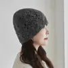 Venta al por mayor transfronteriza 2026 Modelo Nuevo Cachemir Hecho a Mano Crochet Calado Gorro de Punto Gorro de Cachemir Cálido Gorro Protector de Orejas
