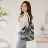 Nueva bolsa de lona de rayas de doble cara para mujer estilo coreano viento perezoso bolsa de mano de gran capacidad para clase y viaje bolsa de lona de mano
