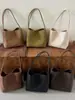 Bolsa balde texturizada vintage estilo coreano transfronteiriça, novo modelo outono 2026, bolsa de ombro e axila simples e de nicho para o dia a dia