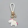 Ahora mismo llavero rico cuero exquisito cuerda trenzada moda caricatura llavero de coche bolsa lindo colgante de poni