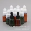 25ml35ml50ml especificación completa botella cuentagotas para aceites esenciales botella marrón verde oscuro transparente cabeza de goma negra y blanca alta calidad