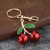Acessório de liga metálica tipo fruta cereja translúcido com lantejoulas grandes dupla face Pingente de chaveiro DIY para bolsas de meninas