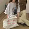Camiseta de manga corta de algodón puro con estampado de perro de dibujos animados estilo europeo para mujer 2026 verano talla grande MM top adelgazante moderno
