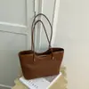 2026 Verano Nuevo Retro Textura Simple Moda Bolso Cubo Color Sólido Nicho Casual Alto Valor Bolso de Hombro Tendencia