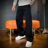 Nova moda de rua masculina de outono, estilo americano cool, jeans casuais largos, confortáveis e com corte curvo.