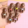 Nuevos Accesorios de Muñeca de Resina Negra DIY Pegamento de Crema Decoración para Funda de Teléfono Colgante de Personaje de Dibujos Animados Venta al por Mayor