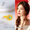 Mismo estilo que Puzuo Gold Shop oro arena turquesa incrustado diamante girasol collar pendientes anillo temperamento conjunto de joyería simple para mujer