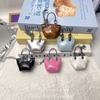 Nuevo Colgante de Mini Bolso Colorido Cadena Exquisita Accesorio de Bolso Pequeño de Cuero Mini Bolso de Cuero con Cera de Aceite Colgante para Coche