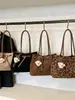 Bolso de mano retro transfronterizo, bolso de hombro para mujer de gran capacidad, nuevo bolso de mano y bolso de hombro de moda simple para commuting de otoño 2026