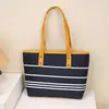Bolso tote tipo cubo a rayas de alta gama para mujer, nuevo, elegante, versátil, de un solo hombro, cruzado, para llevar debajo del brazo