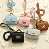 Nueva funda de espejo para auriculares de color sólido en forma de corazón, mini monedero simple, llavero portátil, accesorio de bolso de alta gama