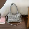 Bolso de mano moderno estilo coreano 2026 Modelo nuevo Color sólido Versátil Moda Hombro Cruzado Bolso de nicho Bajo el brazo Bolso de mujer
