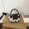 Bolsa pequena quadrada estilo fresco e doce para mulheres, atacado, novo modelo de verão 2026, bolsa de ombro color block, bolsa transversal moderna