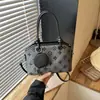 Bolso retro de alta gama para mujer 2026 nuevo estilo bolso de hombro único para el día a día bolso cruzado versátil bolso tipo concha de gran capacidad