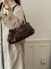 Bolso de Mano de Cuero Suave Color Sólido Lujo Ligero para Mujer 2026 Nuevo de Gama Alta para el Trabajo Transfronterizo Simple Moda Bolso de Hombro Único para el Trabajo