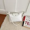 Comércio exterior transfronteiriço, bolsa de ombro feminina tecida minimalista 2026 nova coleção de outono, estilo coreano para o dia a dia, bolsa de ombro requintada em formato de bolinho