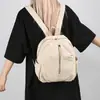 Mochila escolar para niñas 2026 principios de otoño nuevo estudiante color liso simple ligera mochila de viaje de moda versión coreana alta apariencia bolsa de doble hombro