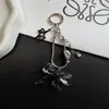 Nuevo y exquisitamente elegante correa para teléfono de nudo de lazo y hueso de serpiente, llavero corto versátil y accesorio para bolso