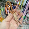 Cordón para teléfono móvil de color contrastante con hebilla de montañismo, cuerda corta para muñeca tejida, portátil, de seguridad, anti-pérdida, cordón para bolsa.