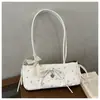 Bolsas Estampadas de Nicho Primavera e Verão para Mulheres 2026 Novo Estilo Versátil Bolsa de Ombro/Axila para o Dia a Dia Bolsa de Mão Fashion Bolsa Baguete
