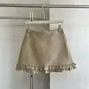 Saia mini de cor sólida estilo suave em linha A com uma elegante barra franzida, cintura alta, valoriza a silhueta, saia versátil para figuras baixinhas.