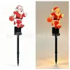 Nuevas luces solares de Navidad para decoración de ambiente, luces de suelo brillantes de Papá Noel, luces para césped de patio exterior