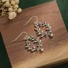 Hermosos aretes personalizados simples para mujer estilo retro étnico flor hueca floreciendo ricos aretes de rama de olivo aretes al por mayor