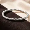 Pulseira de aço titânio com design espiral, estilo INS simples europeu e americano, modelo feminino, moda popular transfronteiriça, pulseira versátil de aço inoxidável