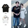 Camiseta de Manga Corta Moderna Estilo Americano con Estampado Divertido de Dibujos Animados 2026 Verano Estilo Pareja Cuello Redondo Algodón Puro Holgada