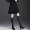 Falda de lana simple y elegante para mujer, nuevo modelo otoño 2026, de cintura alta, adelgazante, reductora de edad, falda de paraguas en línea A