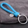 Al por Mayor Punto Creativo Cuerda de Cuero Trenzada Círculo Único Llavero Muñeca Bola de Pelo Llavero Accesorios para Llaves Joyería