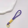 Correa de Muñeca Trenzada Estilo Ins Lanyard Nudado Cuerda Corta de Silicona Colgante Antiperdida para Teléfono Dopamina