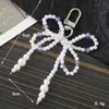 Nuevo Colgante Creativo de Cadena Colgante con Lazo de Perlas para Bolso, Funda de Teléfono, Llavero, Adorno, Exquisito Accesorio de Regalo Pequeño