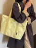 Bolso tote simple de gran capacidad, nuevo bolso tote casual de lona de color liso, estilo moderno, bolso de hombro para el trabajo, principios de otoño 2026