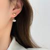 Diseño de nicho de sal de moda exquisitos aretes de botón de alta calidad aretes ovalados de metal con forma de frijol un arete de dos piezas para mujer