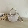 Bolso de hombro tejido elegante y sencillo para mujer, nuevo bolso cruzado tipo cubo con textura de moda de verano 2026