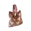 Nuevos bolsos de moda de celebridades de Internet para mujer, bolso de cubo de lana tejida, bolso de mano casual, bolsa para el almuerzo, venta al por mayor