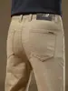Pantalones gruesos de negocios casual de alta gama de Hong Kong para otoño/invierno 2026 para hombre, cómodos, corte recto ajustado, versátiles, con forro polar