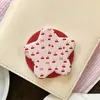 Superventas transfronterizo soporte magnético con airbag en forma de corazón con estampado de lunares de dibujos animados, soporte magnético para teléfono retráctil y plegable