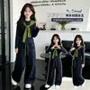 Conjunto de otoño para niña 2026 nuevo elegante top tipo chal de alta gama para niños y pantalones de trabajo de primavera/otoño conjunto de dos piezas