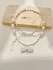 Collar de Perlas de Agua Dulce con Colgante de Lazo de Gama Alta Estilo Lujo Ligero Joyería de Nicho