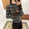 Suéter de punto con botones y cuello semi-alto a la moda estilo Hong Kong para mujer, prenda interior para otoño e invierno, bloques de color, rayas, ajuste ceñido